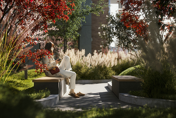 This serene image by Yellow Studio from Tallinn captures a moment of tranquility in the residential complex of Riga. A woman enjoys a peaceful break, immersed in her thoughts, surrounded by the vibrant colors of autumn foliage and the soft textures of ornamental grasses, illustrating the harmonious blend of nature and urban living.